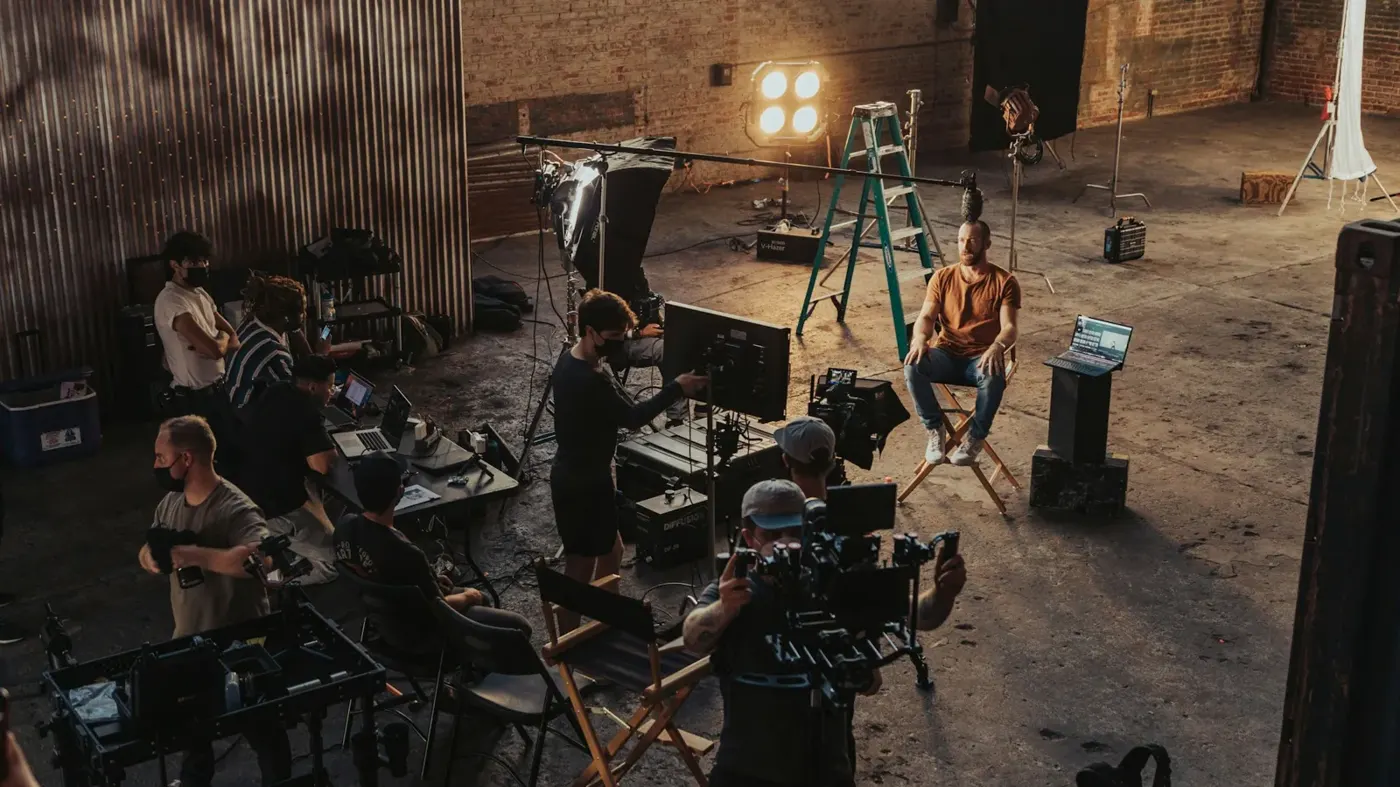 A film crew around a camera on set