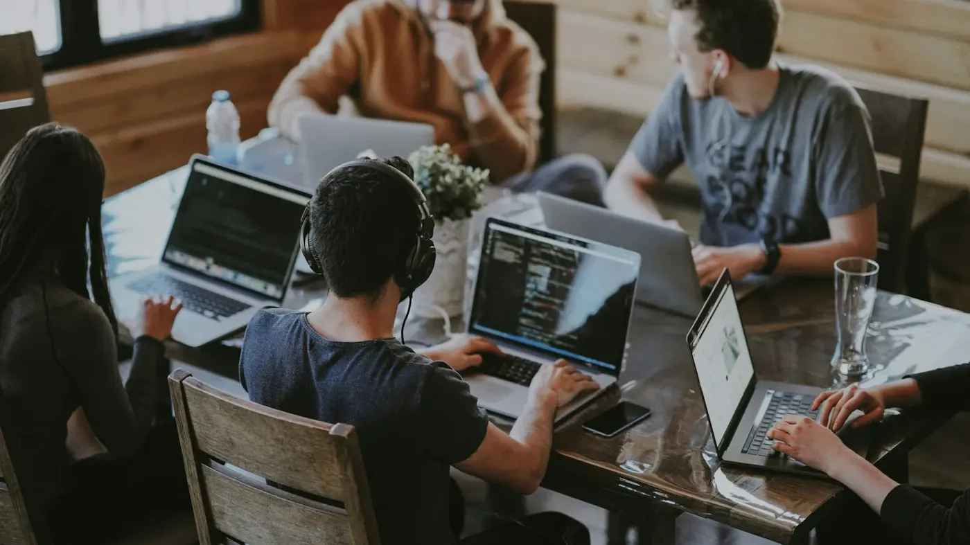 A team working together on laptops